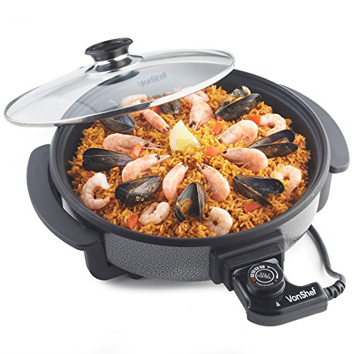 Silver 30cm VonShef multi cooker with a glass lid, featuring shrimp and mussels on a bed of rice, and a temperature control dial on the side.