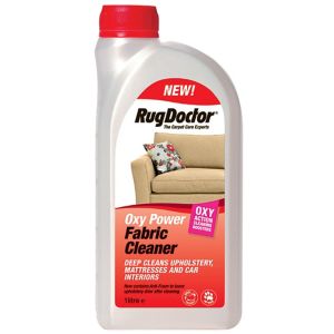 Rug Doctor Oxy Power Fabric Cleaner in a 1-litre white bottle with a red cap, featuring a label highlighting its deep cleaning properties for upholstery and car interiors.