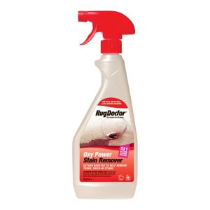 Clear plastic spray bottle with a red trigger nozzle, labeled "Rug Doctor Oxy Power Stain Remover," featuring a white and red design and a stain removal graphic.