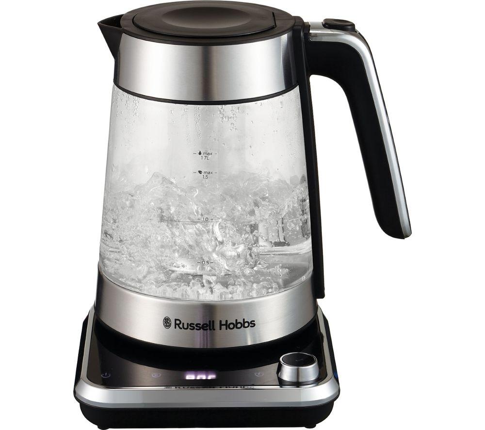 Clear glass kettle with a silver stainless steel base, black handle, and digital temperature display, showcasing boiling water inside.