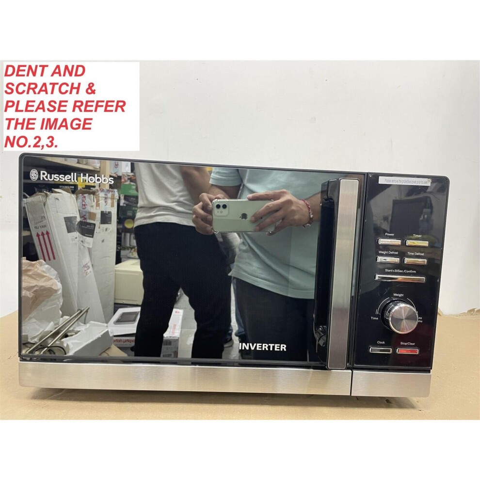 Black Russell Hobbs Inverter Microwave with a shiny finish, 25L capacity, 900W power, digital controls, and a silver handle, featuring a dent and scratch on the surface.