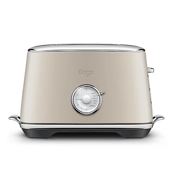 Sage Toast Select Luxe Toaster in Almond Nougat features a sleek, almond-colored body, chrome accents, a dial for browning control, and a compact design.