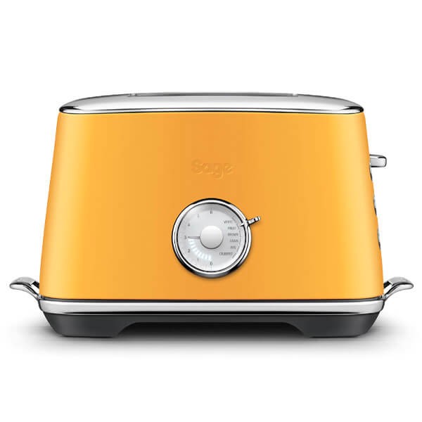 Sage Toast Select Luxe Toaster in saffron butter color, featuring a sleek design, chrome accents, and a dial for adjusting browning levels.
