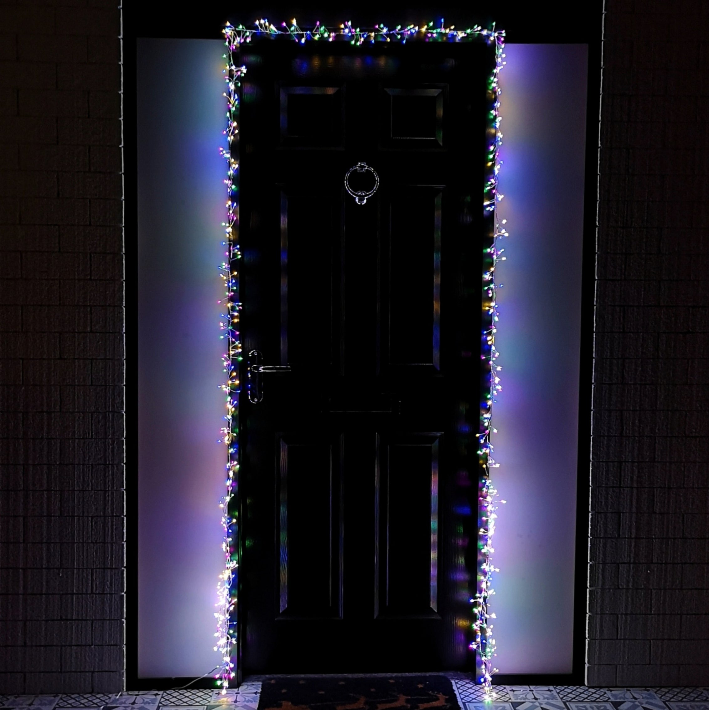 Multi-coloured 5.5M LED Christmas door lights by Samuel Alexander, featuring a vibrant array of lights outlining a black door, creating a festive glow.