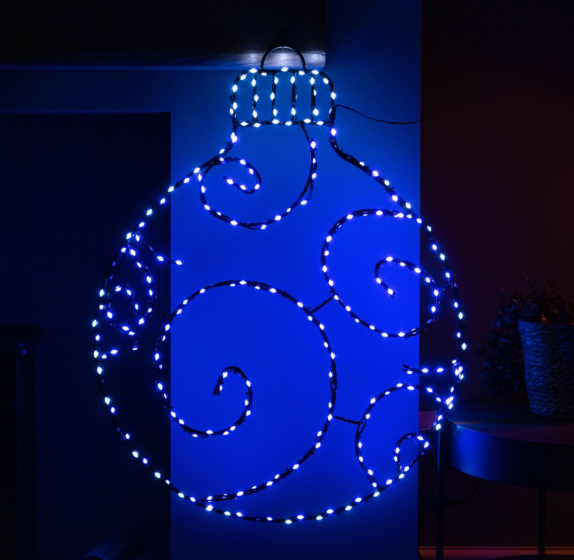 Large 78cm metal Christmas bauble silhouette in blue and white LED lights, featuring static and twinkling effects, with decorative swirls and a black top.