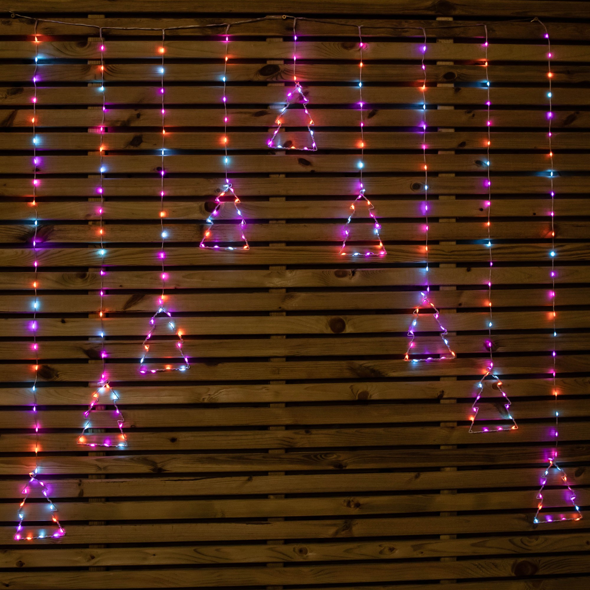 Colorful 1.2m x 1.2m curtain lights featuring 258 rainbow LEDs arranged in triangular shapes, hanging against a wooden backdrop.