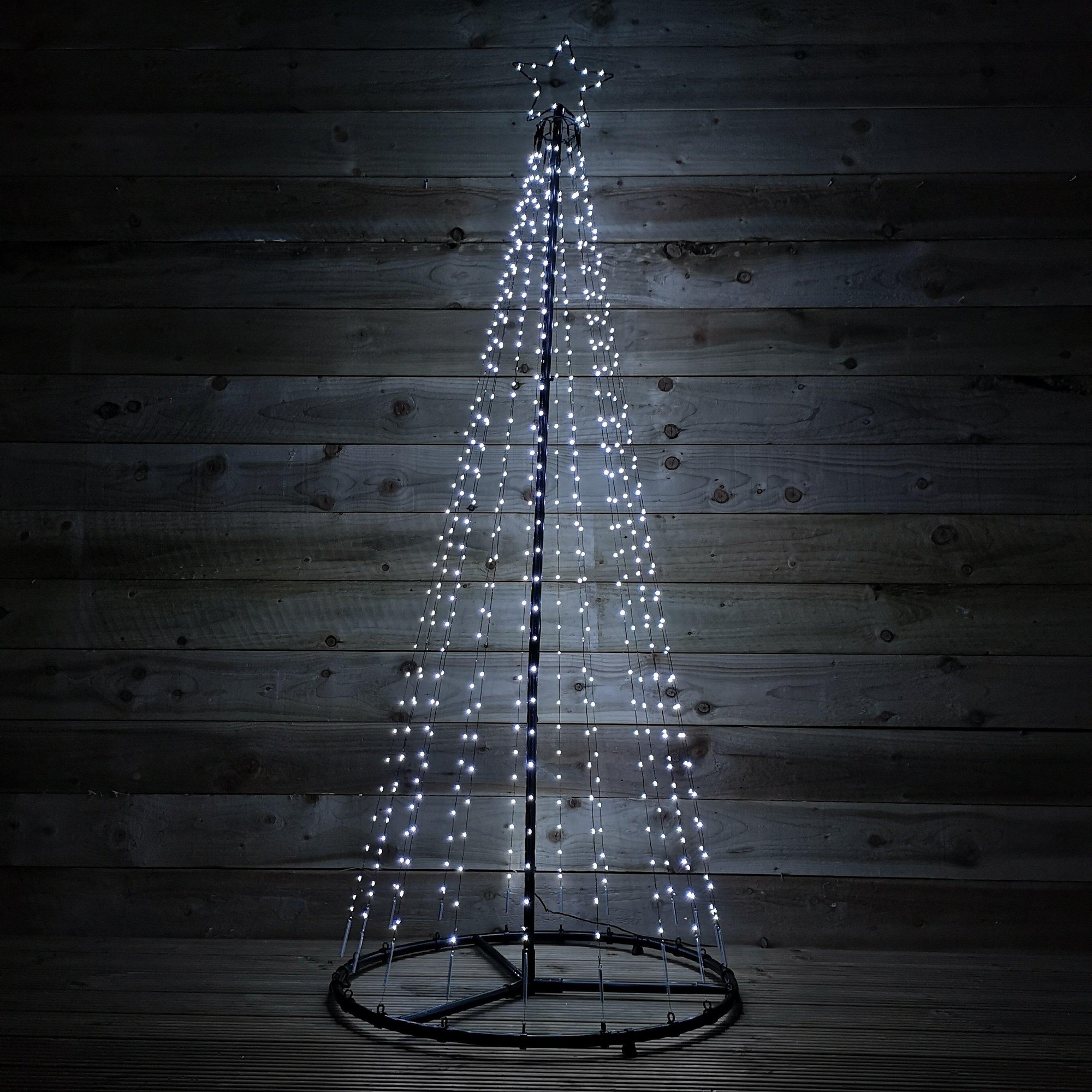 A 1.8M outdoor maypole Christmas tree in black metal, adorned with 560 ice white LEDs, featuring a star topper and a flashing effect for festive illumination.