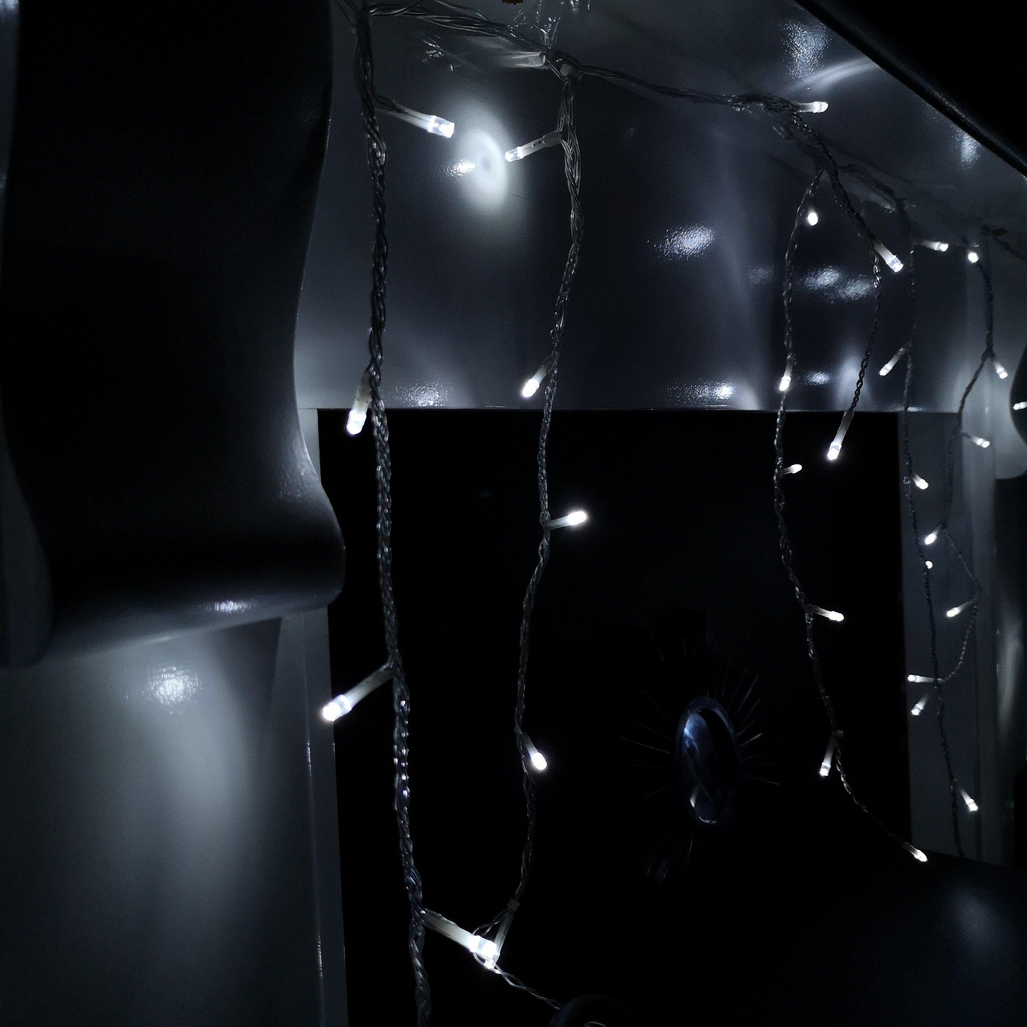 Cool white LED icicle lights on a clear cable, featuring 960 bulbs, designed for indoor and outdoor use, with a multifunction timer for festive illumination.