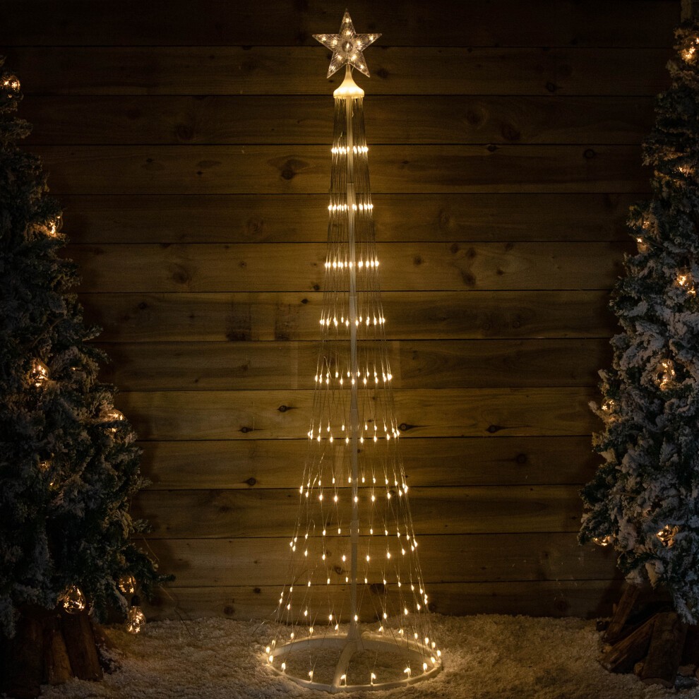 2.5m tall white Christmas cone tree featuring 320 warm white LEDs, a star topper, and a timer function, set against a rustic wooden backdrop with snowy decorations.