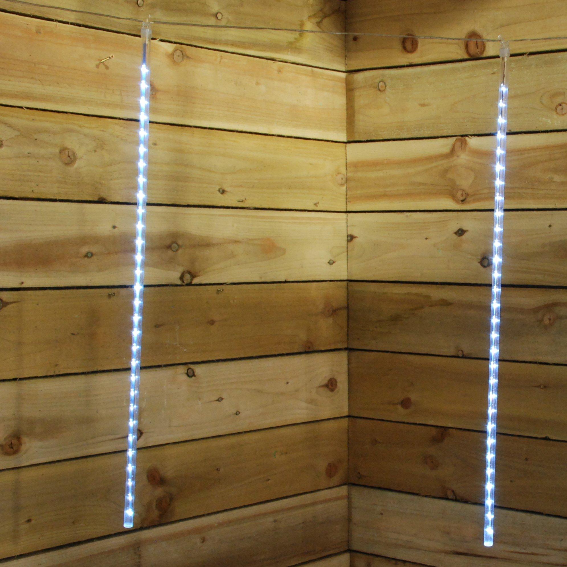 Five 70cm LED lights in white, designed to create a snowing effect, hanging against a wooden wall, showcasing a festive and decorative ambiance.