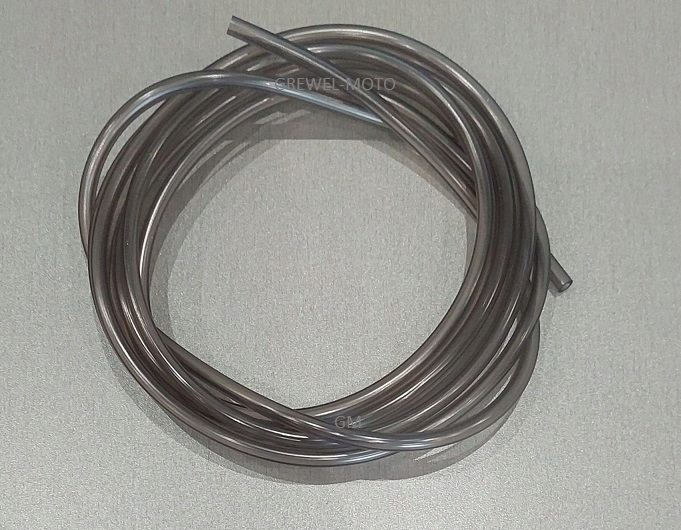 Clear PVC delivery tubing coiled in a circular shape, featuring a flexible and transparent design, suitable for various fluid delivery applications.