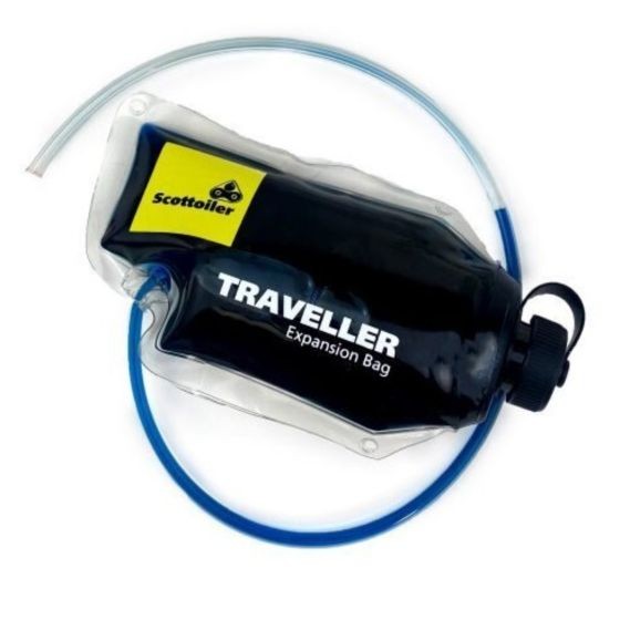 Black plastic Scottoiler Traveller Expansion Bag with a yellow logo, featuring a clear tube for oil delivery, designed as a range extender for chain oilers.