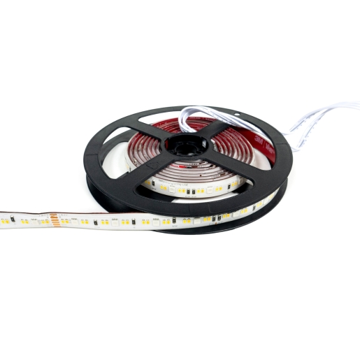 Flexible 5m LED strip light on a black reel, featuring RGB and CCT capabilities, with a white backing and multiple small light diodes visible along the strip.