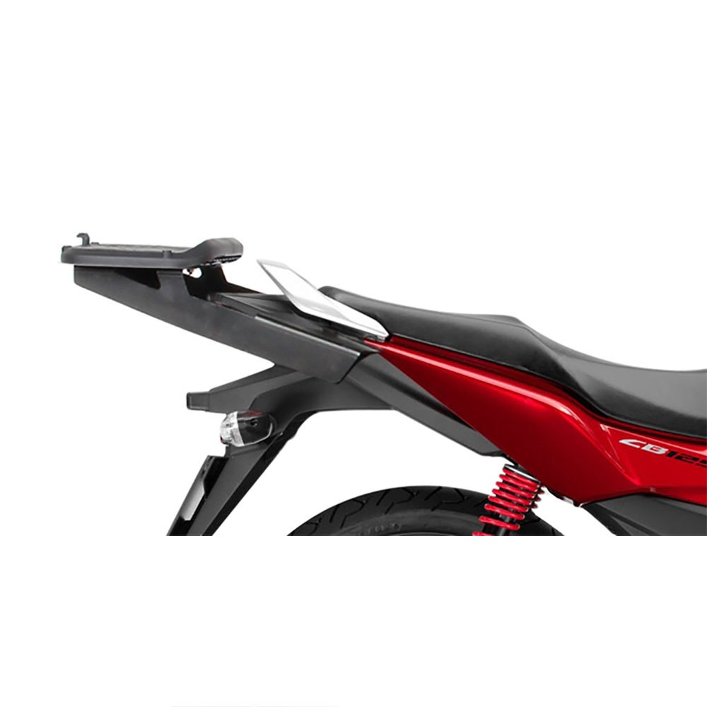 Black Shad Top Master top case carrier for Honda, featuring a sleek design, sturdy material, and a size of 65 cm, mounted on a motorcycle with a red body and visible suspension.