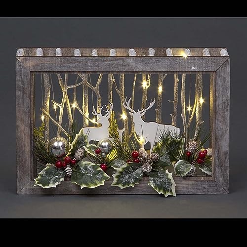 Wooden rectangular scene featuring two white reindeer among illuminated branches, decorated with green foliage, red berries, and silver ornaments, measuring W38xD6.5xH25cm.