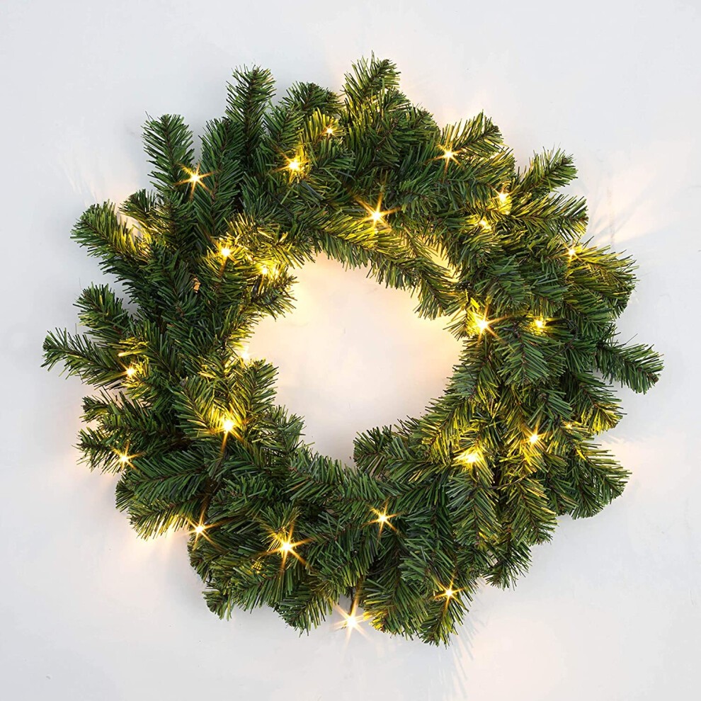 55cm prelit Alaskan pine Christmas wreath featuring lush green foliage and warm white lights, perfect for festive decoration.