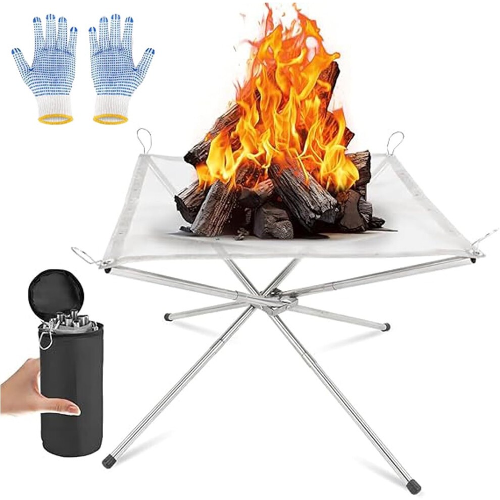 Portable stainless steel fire pit with a mesh top, surrounded by logs ablaze, accompanied by blue and white gloves and a black carrying bag for easy transport.