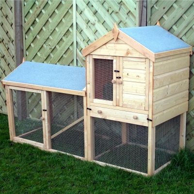 Wooden hutch with a sloped roof, featuring a natural finish, mesh wire panels, and a small door, connected to a spacious run area on the side, set against a green grass background.