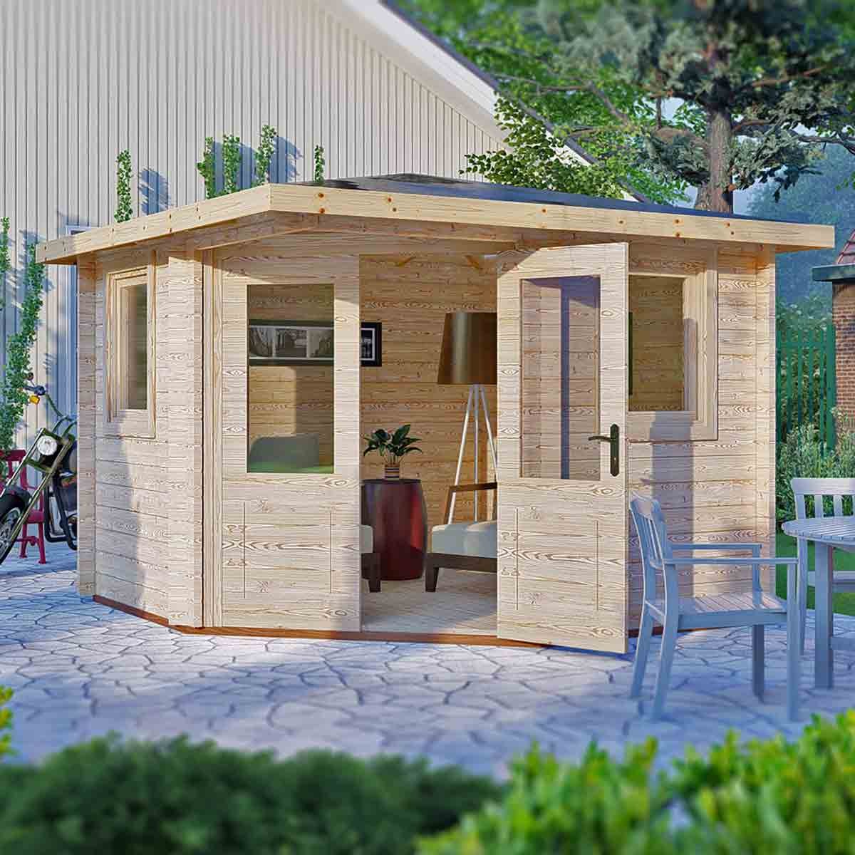 Brown wooden log cabin with a flat roof, featuring large glass windows and double doors, set in a garden with stone paving and outdoor furniture.