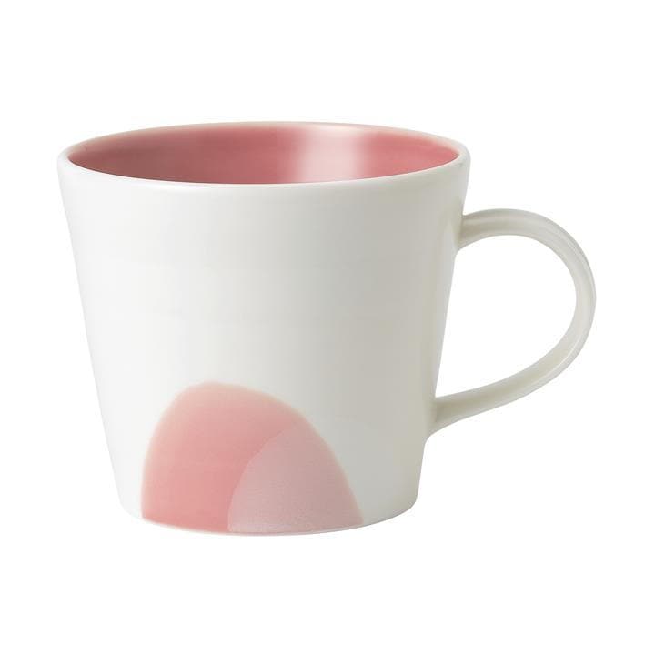 White ceramic mug with a tapered design, featuring a smooth pink interior and a subtle pink abstract design on one side.