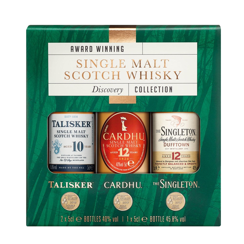 Three miniature bottles of Single Malt Scotch Whisky in a green and gold box, featuring Talisker, Cardhu, and The Singleton, with labels indicating age and alcohol content.