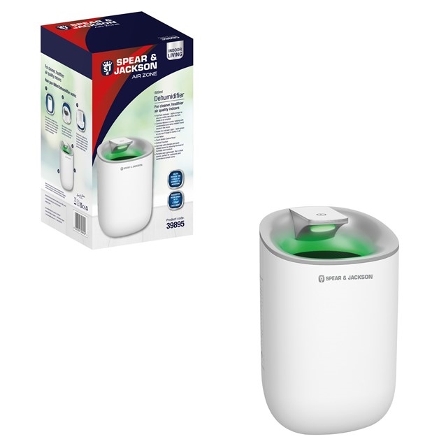 White 600ml dehumidifier with a sleek design, featuring a green indicator light and a simple control panel, displayed alongside its colorful packaging.