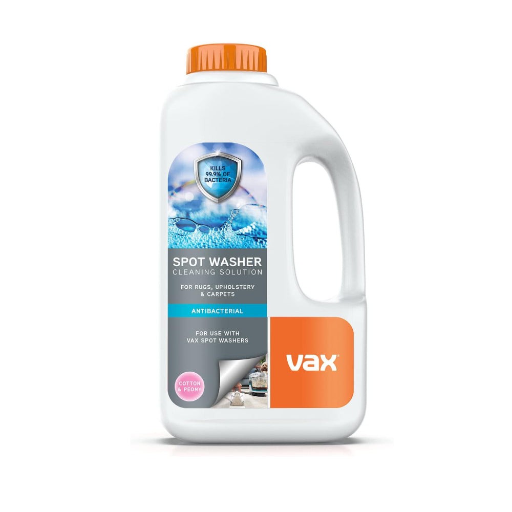 Vax Spotwash Antibacterial Solution in a white 1.5L bottle with a bright orange cap, featuring a label highlighting its use for rugs, upholstery, and carpets with a cotton and peony scent.