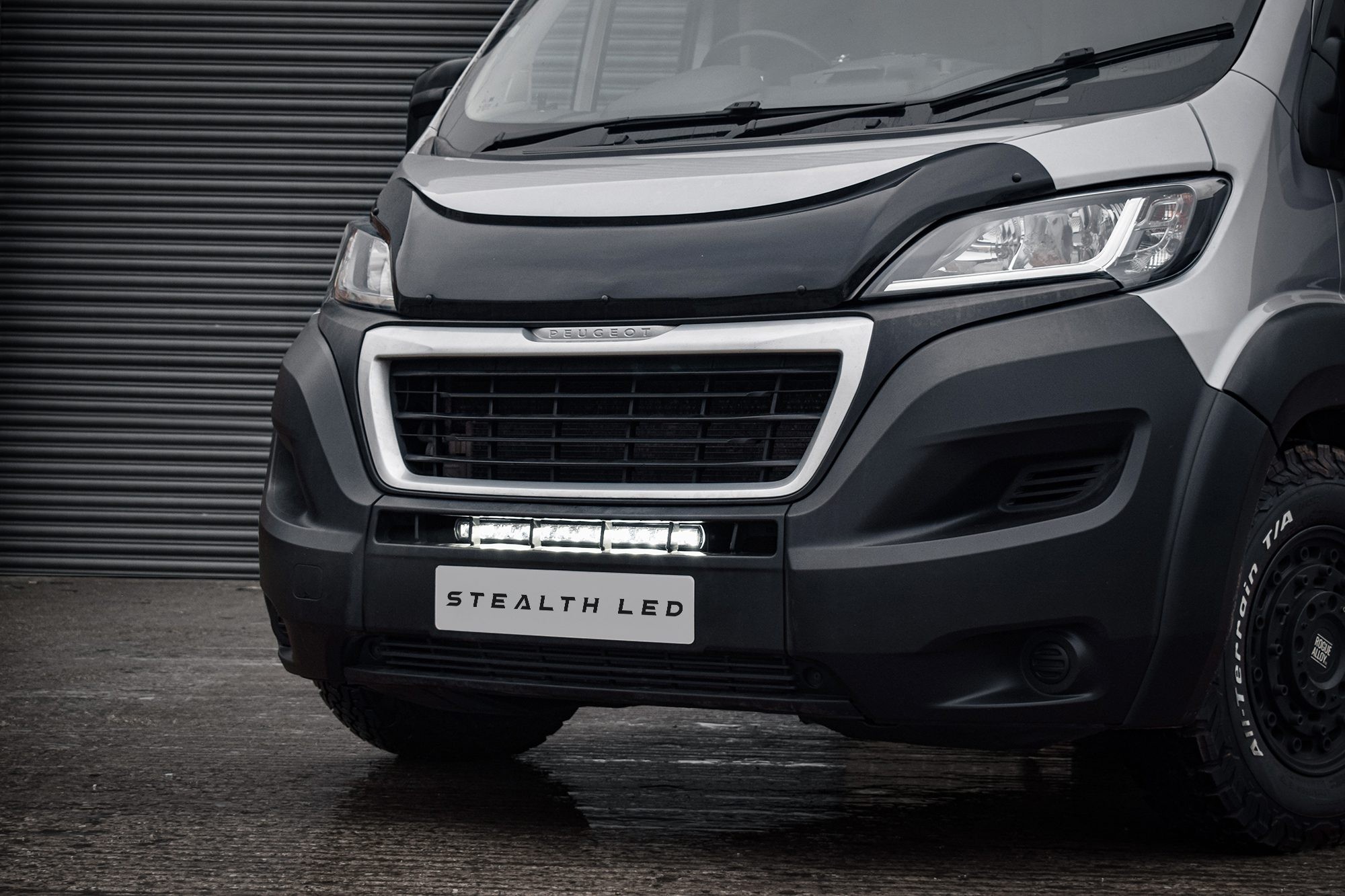 Luminous 20" LED integration kit for Peugeot Boxer (2014-2024) with a sleek black design, featuring bright 8,400 lumens, mounted below the front grille.