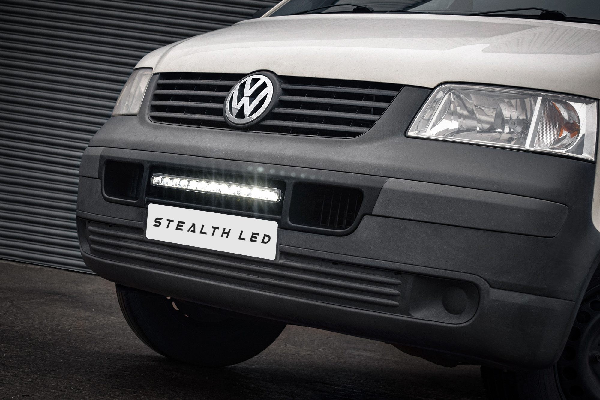 Luminous 20" LED integration kit for VW Transporter T5, featuring a sleek design with 8,400 lumens, mounted beneath the front grille, showcasing a modern, bright appearance.