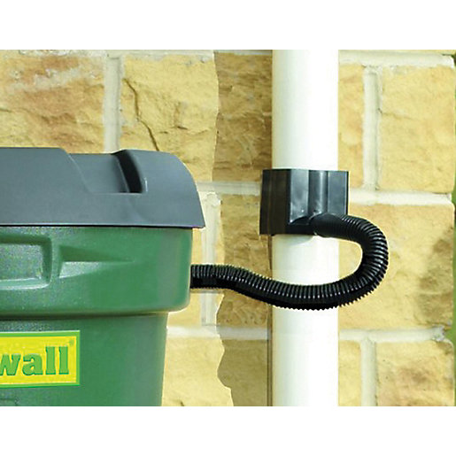Black rain diverter kit attached to a green rain barrel, featuring a flexible black hose connecting to a white downspout, designed for efficient water collection.