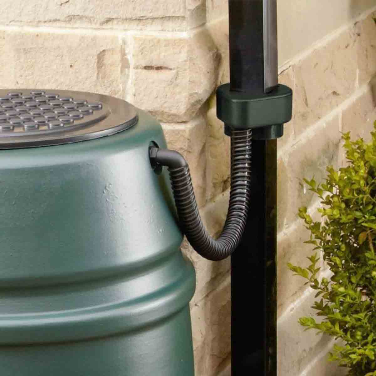 Green Harcostar Universal Rain Trap Diverter made of durable plastic, featuring a coiled hose attachment and a textured lid, designed for efficient rainwater collection.