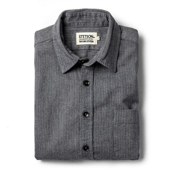 Slate herringbone mechanic shirt featuring a button-down collar, black buttons, and a single chest pocket, crafted from a textured fabric.