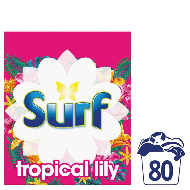 Bright pink packaging featuring a large white flower and tropical foliage, labeled "Surf Tropical Lily & Ylang-Ylang Laundry Powder 4 Kg," indicating 80 washes.