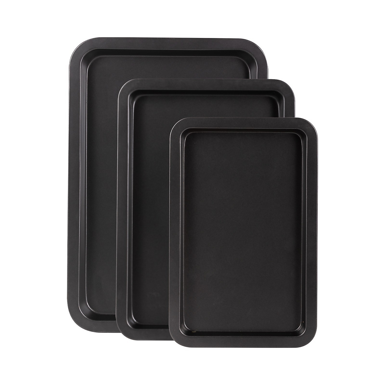 Three black, non-stick oven trays of varying sizes arranged from largest to smallest, featuring a smooth surface and raised edges for easy handling.