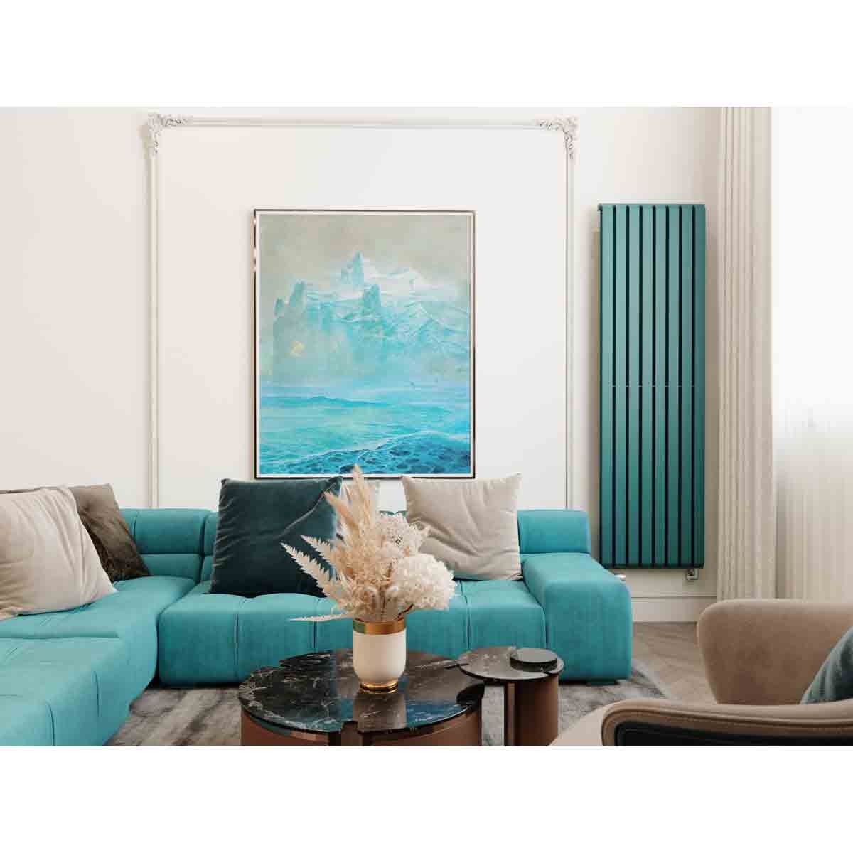 Teal blue Terma WARP-room radiator, 1800x525 mm, featuring vertical slats, mounted on a wall beside a modern living room setup with a painting and plush furniture.