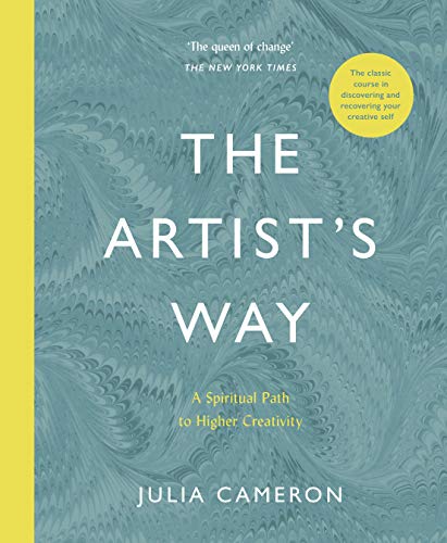 A softcover book with a marbled teal and yellow cover, featuring the title "The Artist's Way" in bold white text and the author's name, Julia Cameron, at the bottom.