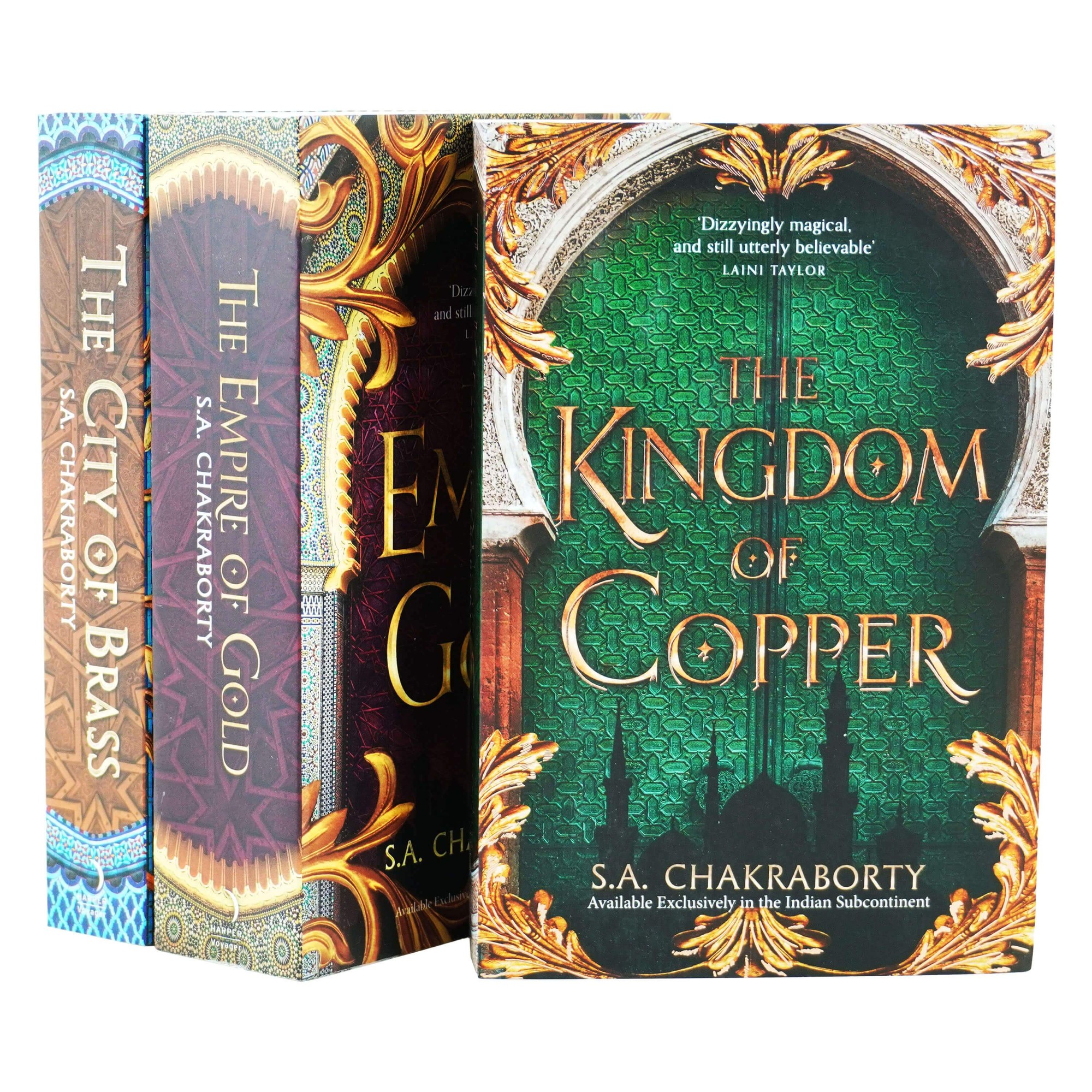 Three hardcover books from "The Daevabad Trilogy" by S.A. Chakraborty, featuring intricate covers with vibrant colors and ornate designs, titled "The City of Brass," "The Empire of Gold," and "The Kingdom of Copper."