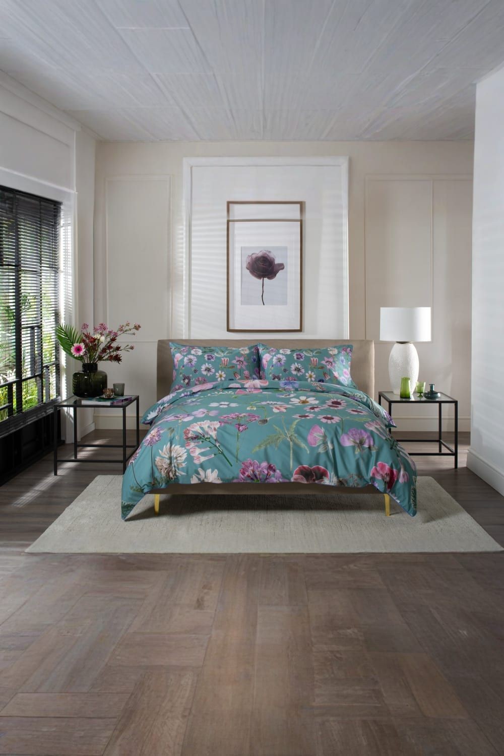 Botanical flower duvet cover set in green, crafted from 200TC 100% cotton, features vibrant floral patterns, displayed on a king-size bed with matching pillowcases in a modern bedroom setting.