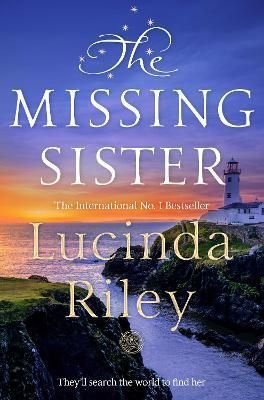 A book cover featuring a scenic coastal landscape at sunset, with a lighthouse and rocky shore, titled "The Missing Sister" by Lucinda Riley in elegant white font.