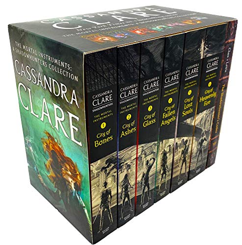 Seven hardcover books in a box set, featuring dark, fantasy-themed covers with vibrant colors, showcasing titles like "City of Bones" and "City of Ashes" by Cassandra Clare.