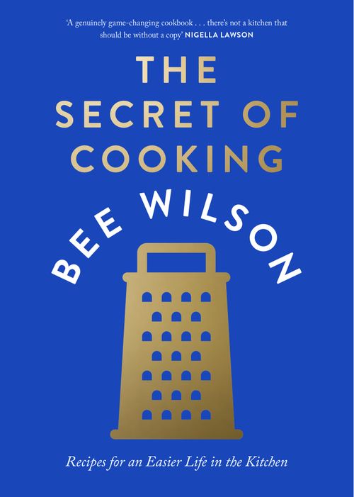 Bright blue cookbook cover featuring gold text for the title "The Secret of Cooking" and author's name "Bee Wilson," with a graphic of a cheese grater at the bottom.
