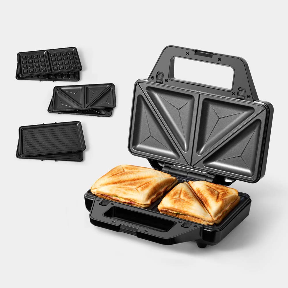 Black toastie maker with removable plates for waffles and paninis, featuring a sleek design and non-stick surface, showcasing two golden-brown toasties inside.