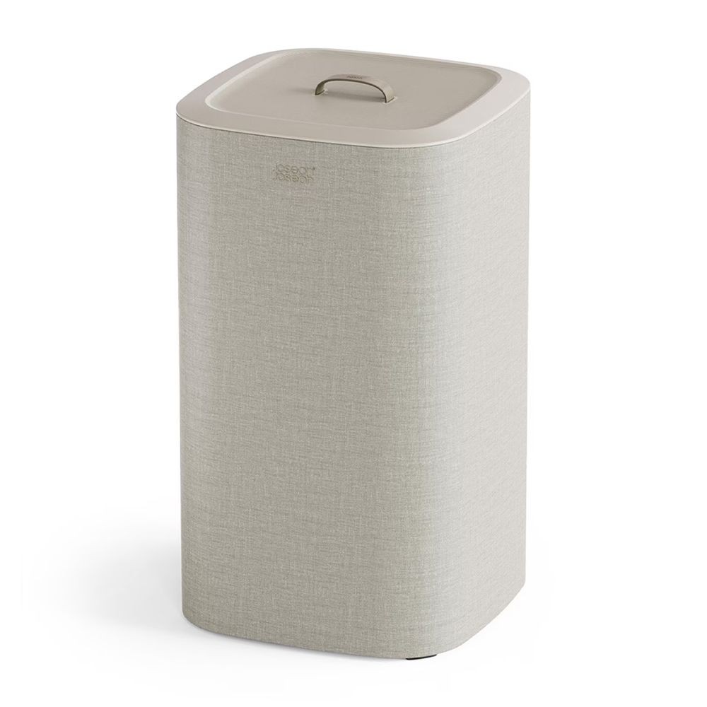 Stylish 60-liter laundry separation basket in light beige fabric with a sleek, rectangular design and a flat lid featuring a convenient handle for easy transport.