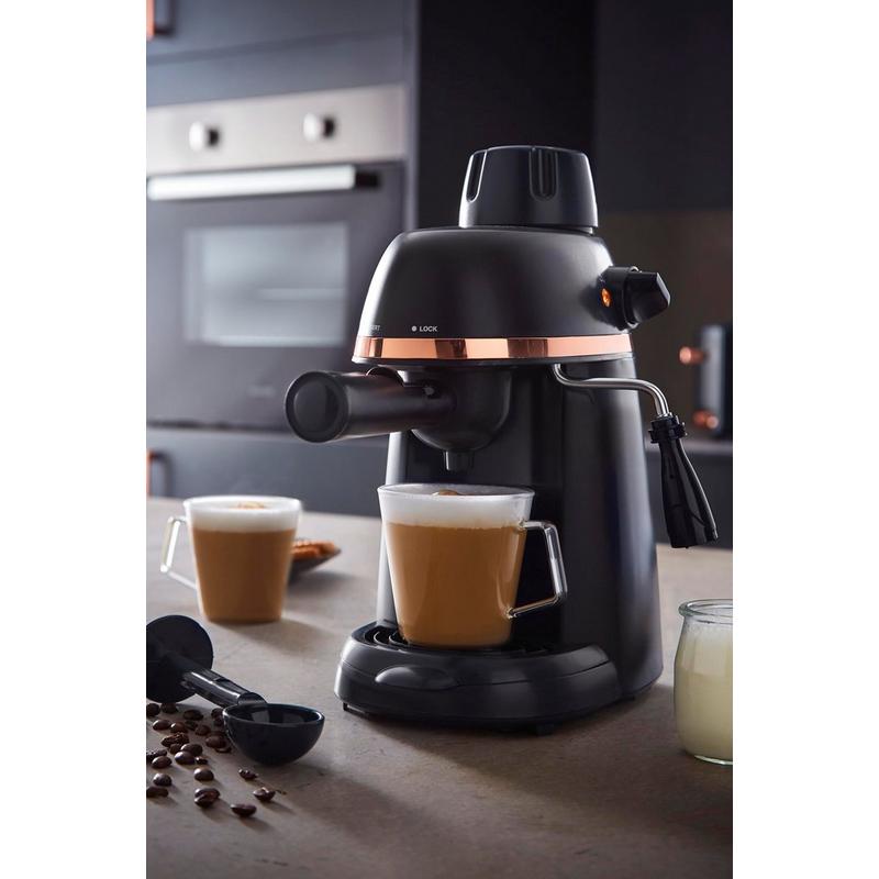 Sleek black Tower Cavaletto Espresso Machine features a copper accent, a steam wand, and a compact design, with two cups of coffee and coffee beans nearby.