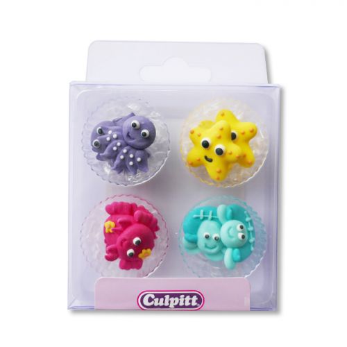 Colorful sugar pipings featuring sea creatures like an octopus, starfish, and crab, in shades of purple, yellow, pink, and turquoise, packaged in a clear box by Culpitt.