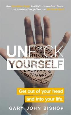 Softcover book titled "Unf*ck Yourself" by Gary John Bishop, featuring a hand with handwritten notes and a white and yellow title against a blue background.