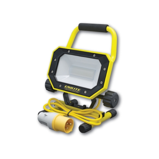 Unilite SL110 ANTI-GLARE site light features a sturdy yellow and black casing, a clear lens, a handle, and a coiled power cord with a yellow plug for 110V connection.