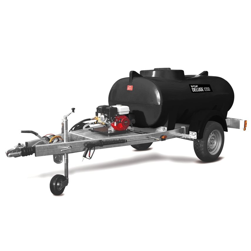 Black cylindrical water tank mounted on a silver trailer, featuring a red Honda petrol engine, hoses, and a sturdy wheel for mobility, designed for high-pressure washing.