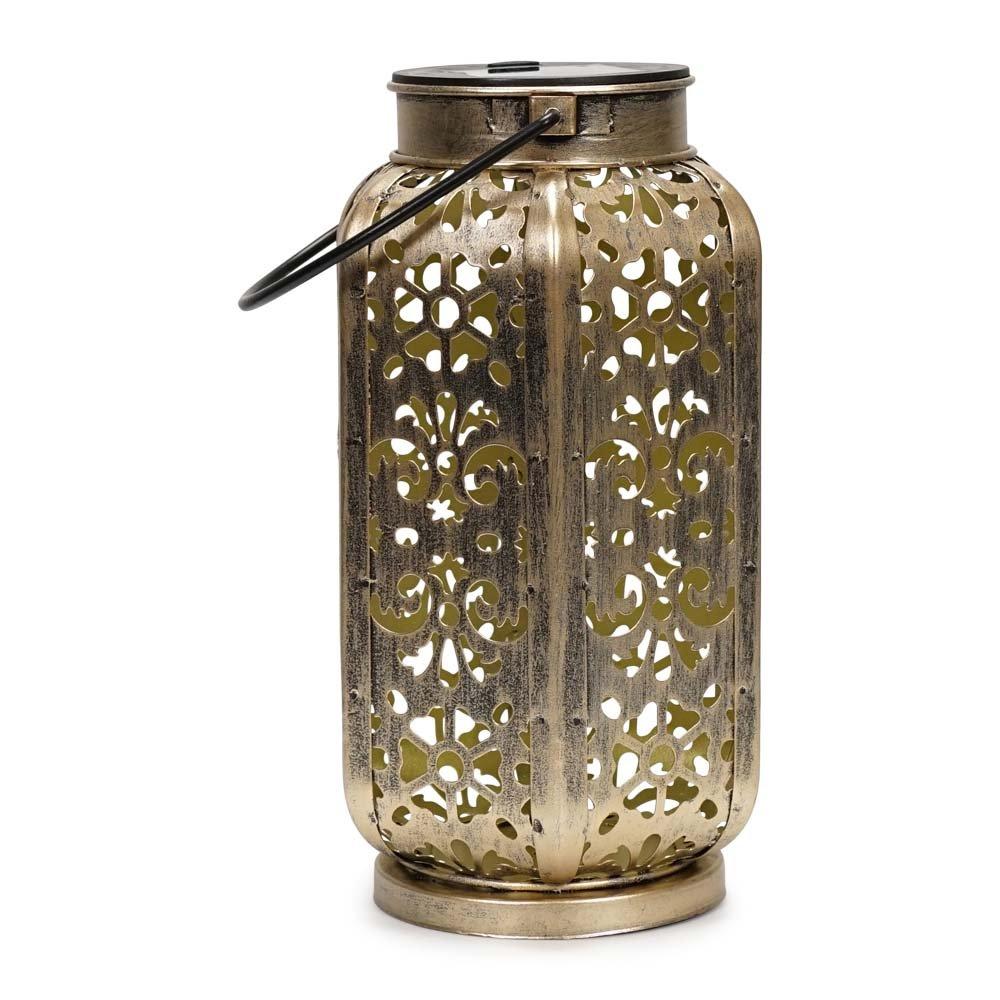 Solar outdoor lantern in antique brass finish, featuring intricate floral cutouts and a metallic gold sheen, designed for decorative lighting.