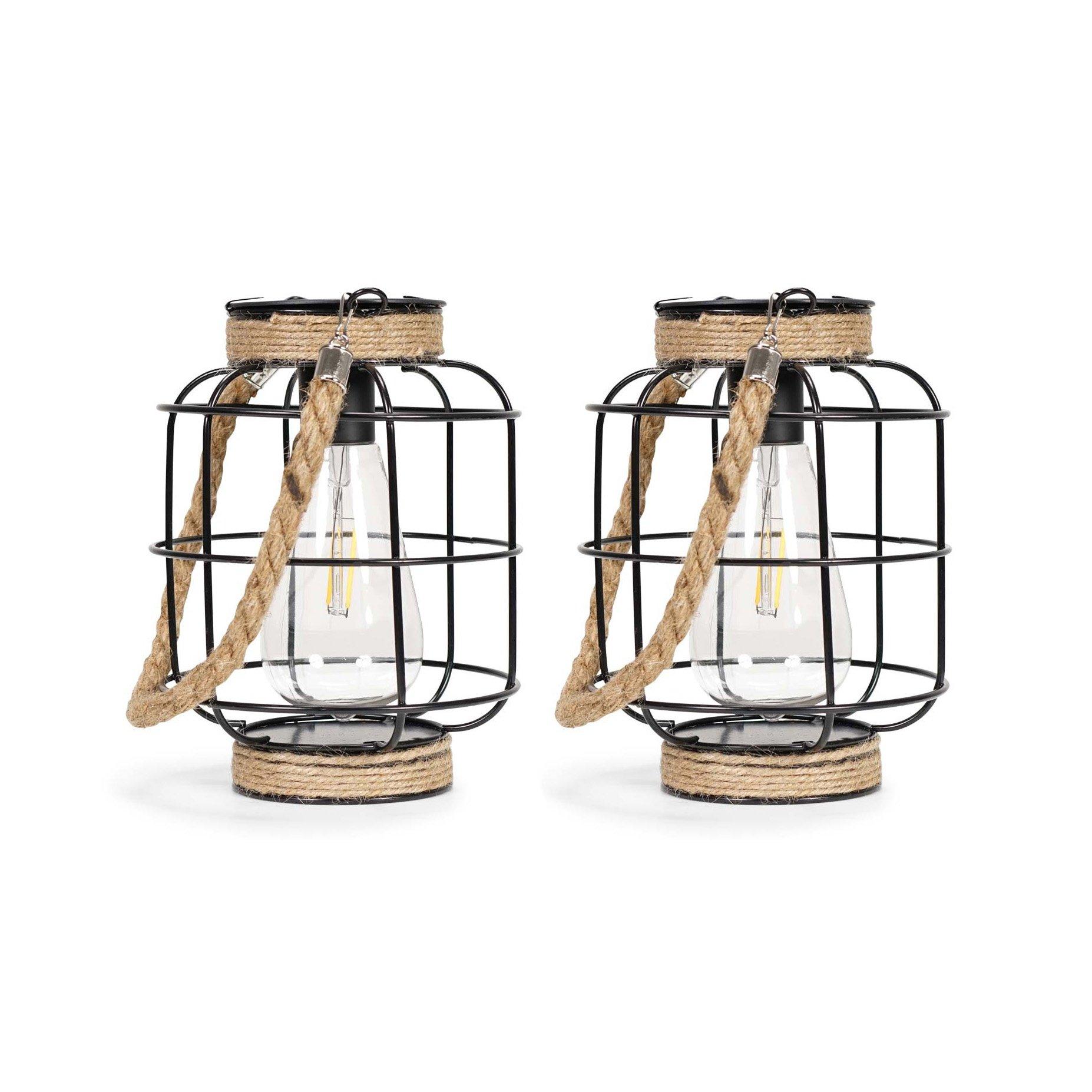 Two black metal outdoor lanterns with a wire cage design, featuring a clear bulb inside, a jute rope handle, and a sturdy base, ideal for adding charm to outdoor spaces.